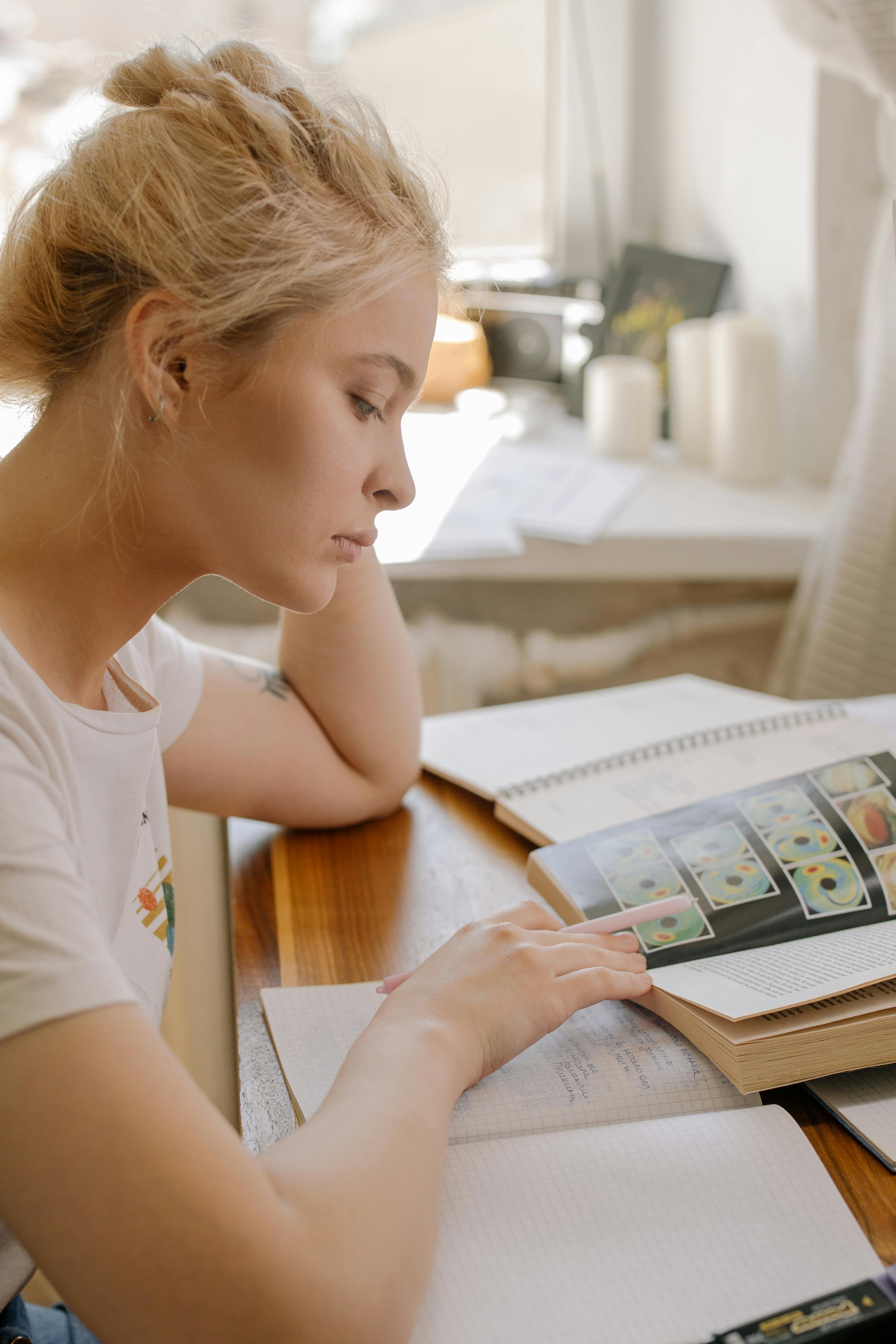 Focused young woman studying independently - self-directed learning in action